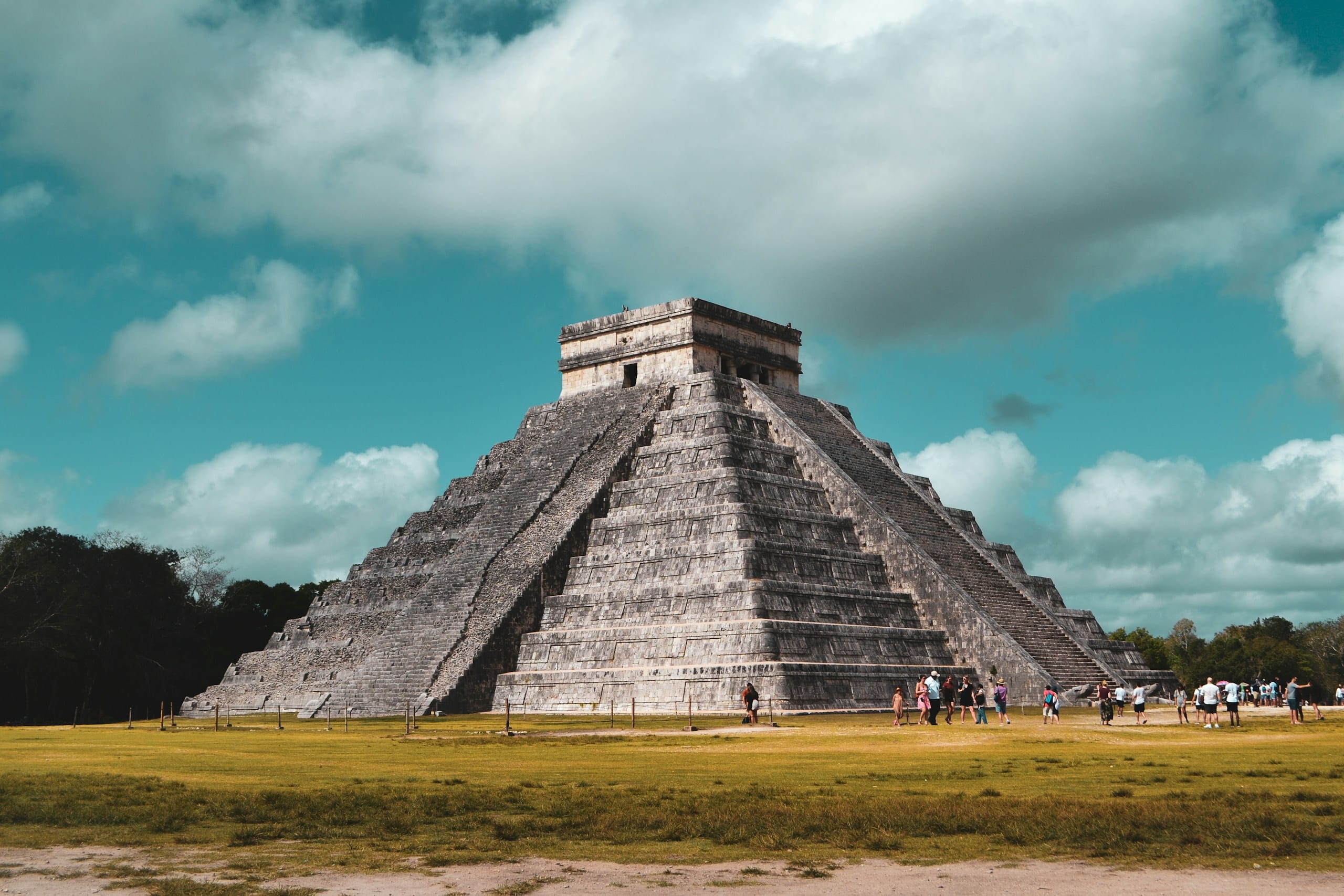 Visitors on the grass in front of El Castillo, Chichen Itza